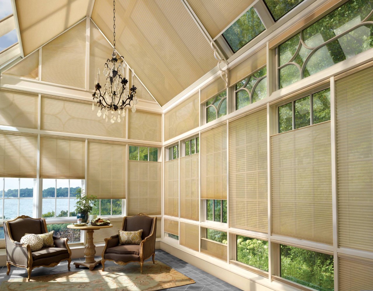 Hunter Douglas Duette® Cellular Shades decorating the many windows of a sunroom at Dreamweaver Interiors & Fabrics near Rehoboth Beach, DE